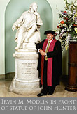 Irvin Modlin in front of John Hunter statue